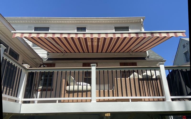 Sunbeam retractable awning with taut, wrinkle-free NorthPort fabric