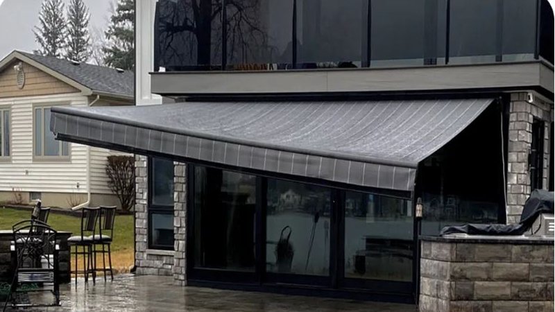 Awning tilted at steep angle to drain water