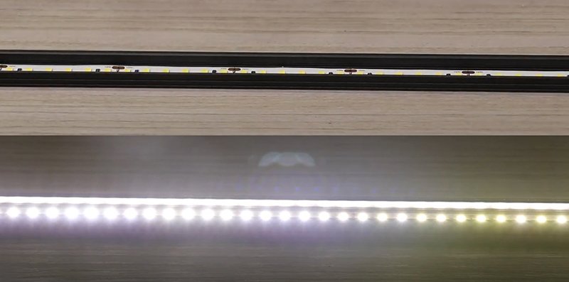 Exposed LED strip lights with no diffuser showing individual hot spots