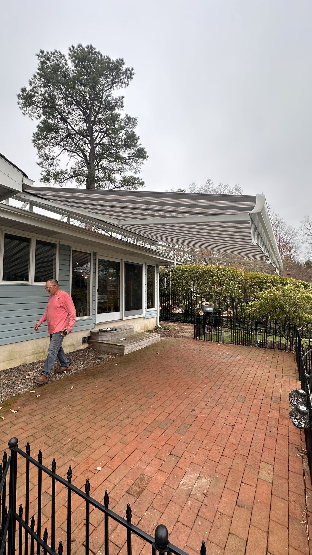 Retractable awning installation lakefront home