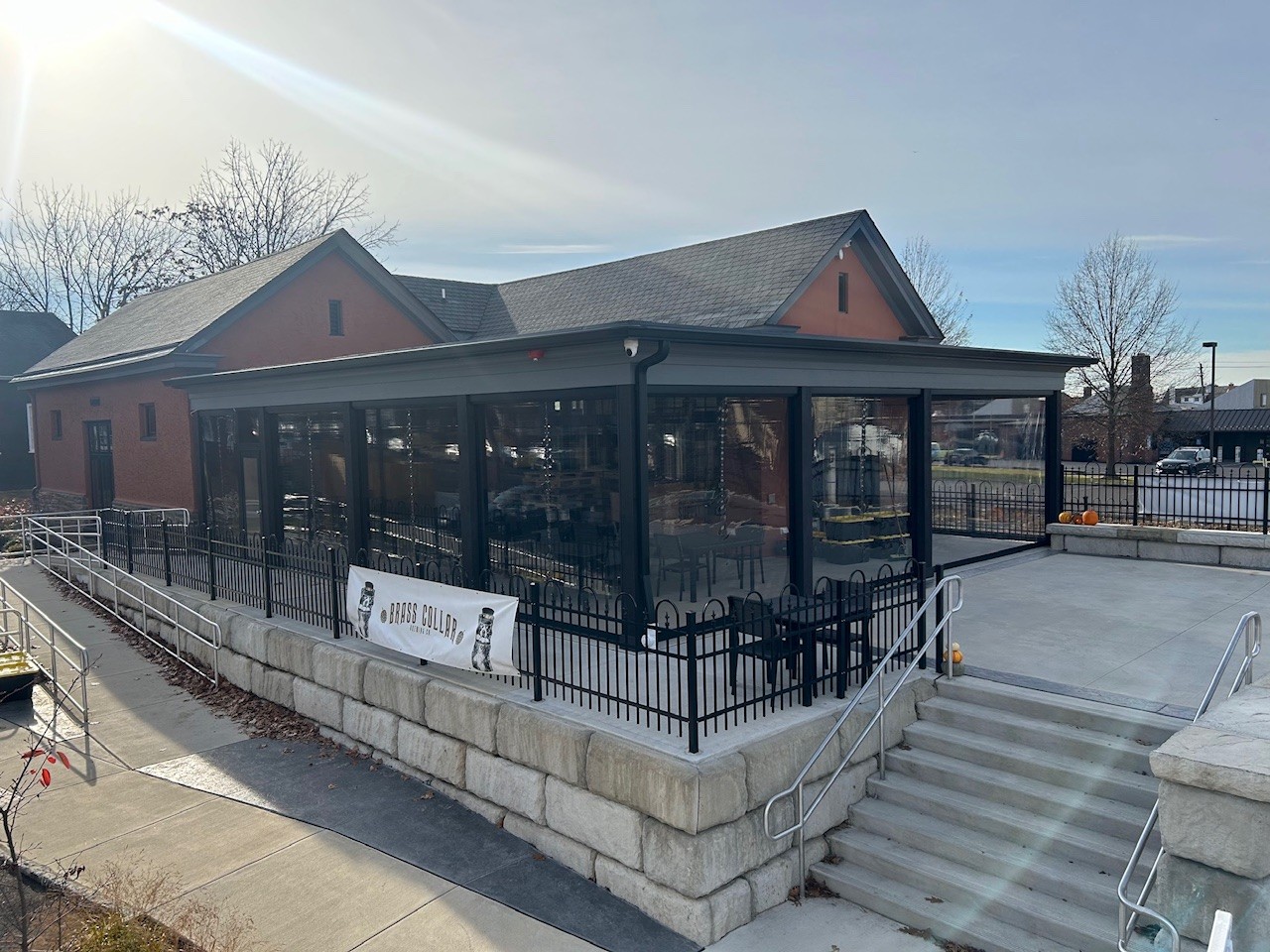 Clear acrylic solar shade enclosure at commercial brewery