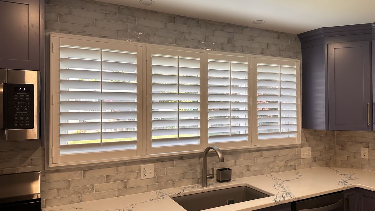 Plantation shutters over kitchen sink